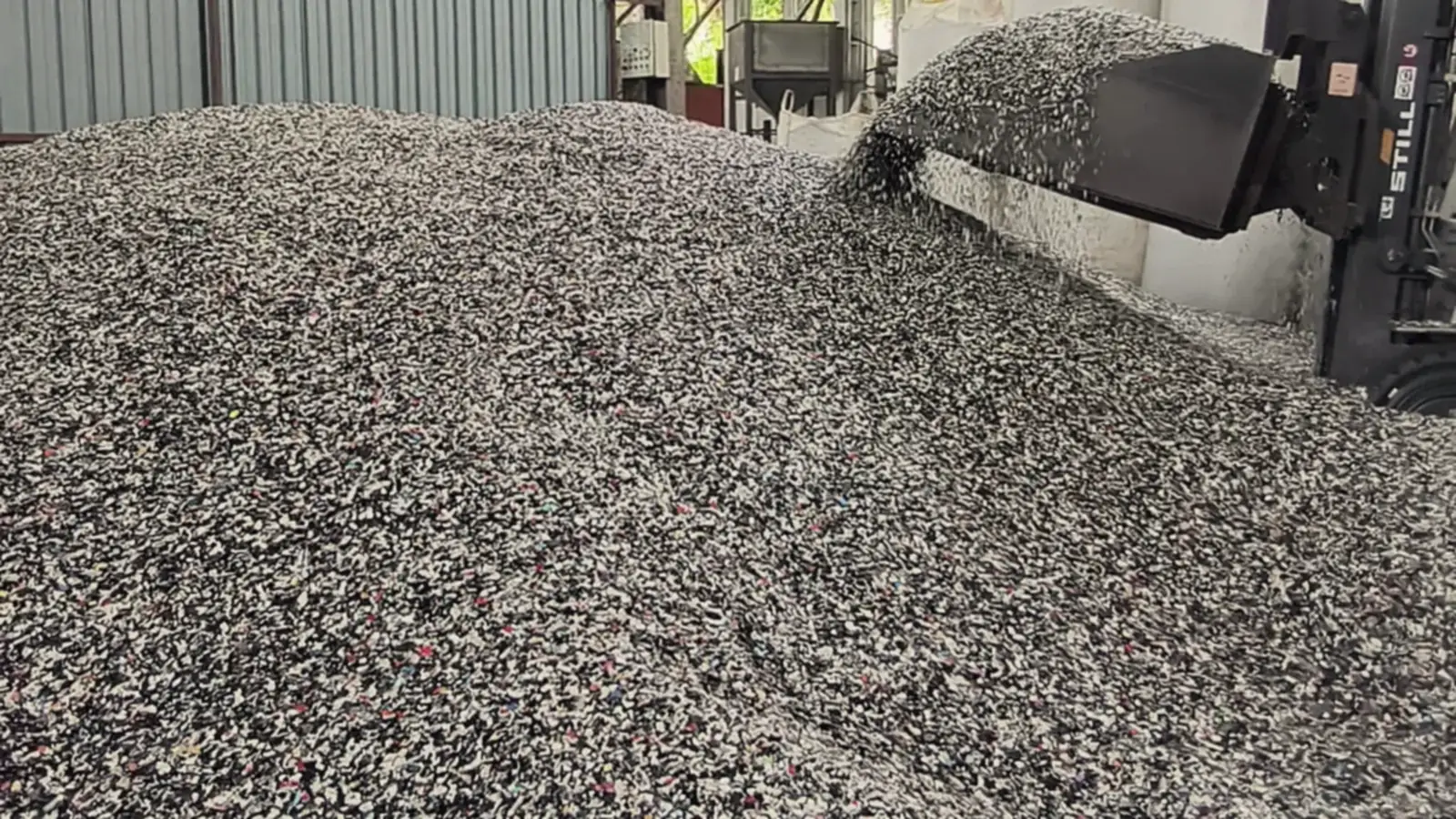 A loader works the flake stockpile