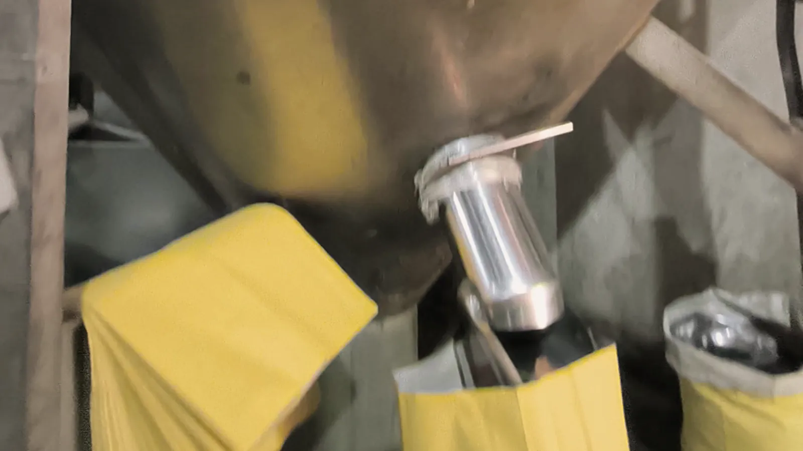 Resin pellets running from the silo spouts into bags