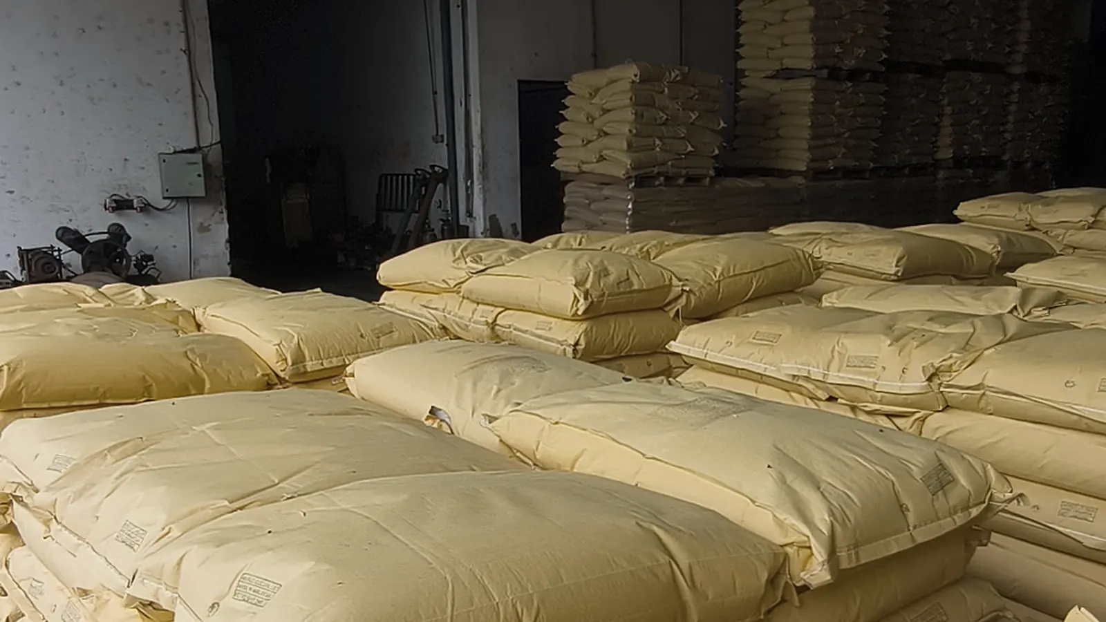 Stacks of bagged resin in the warehouse